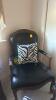 Wooden and Black Leather Chairs with Zebra Throw Pillows and a Zebra Storage Ottoman - 2