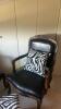 Wooden and Black Leather Chairs with Zebra Throw Pillows and a Zebra Storage Ottoman - 3