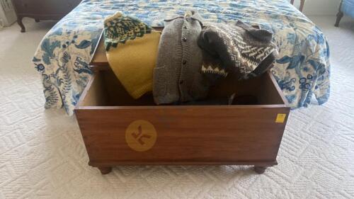 Wooden Storage Chest and Wool Sweaters