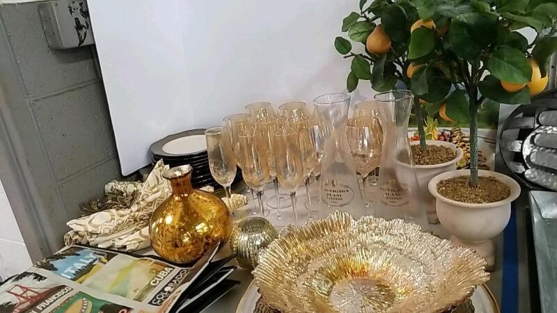 Champagne Flutes, Artificial Lemon Trees, and Plates