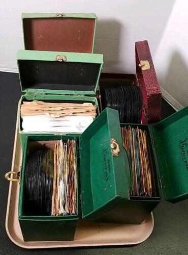 Collection of 45 RPM Records with Storage Cases