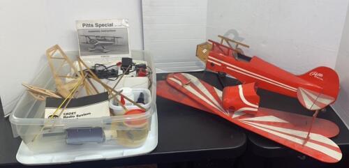 Pitts Special Model Airplane and Bin of Model Airplane Hobby Supplies