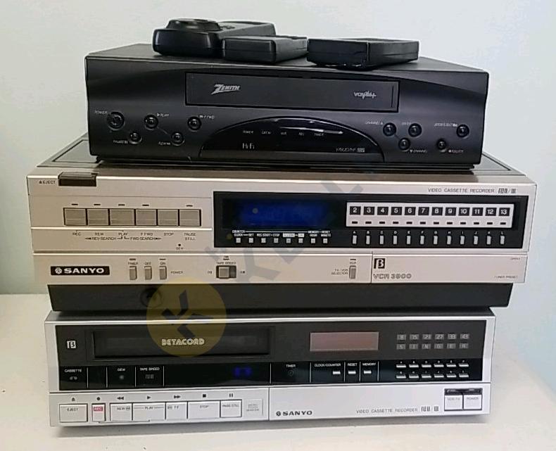 Two Betamax VCRs and a VHS VCR