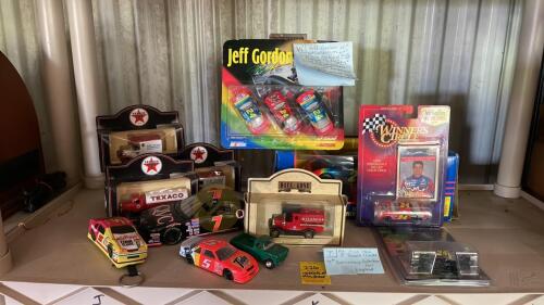 Contents of Shelf with Toy Trucks and Cars