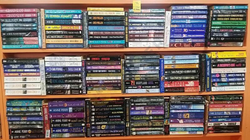 Variety of Paperback Mystery Novels On 3 Shelves