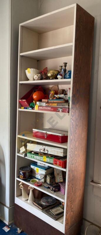 Wooden Bookcase, Brass Candlestick Holders, and More on One Shelf